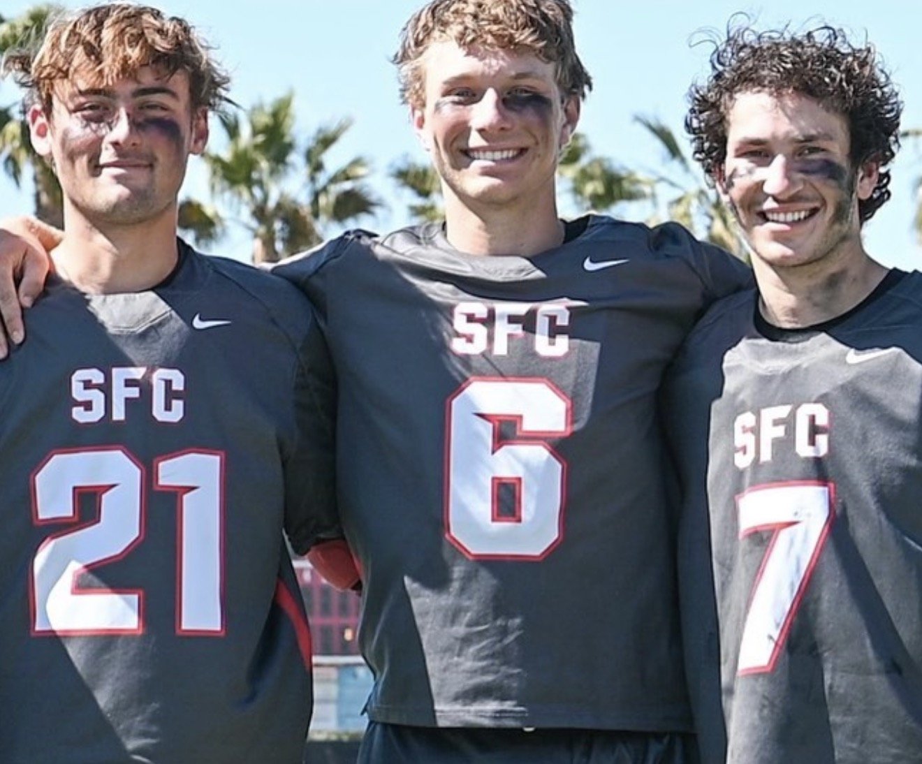 Sam Cooper with two SFC teammates